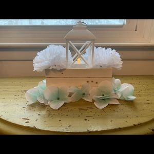Crate centerpiece with blue flowers on the base
